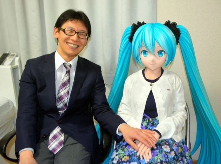 Akihiko Kondo with his life-size Hatsune Miku doll